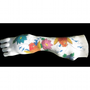 image: Prosthetic arm covering tattoo painting by Hudson Valley NY artist Katrie Arena.  Coy fish design.  Painted in 2011.